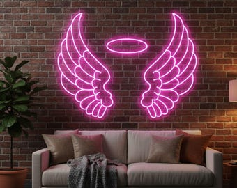 May include: A neon sign in the shape of angel wings and a halo, glowing bright pink against a brick wall. The sign is above a white sofa with throw pillows and a blanket.