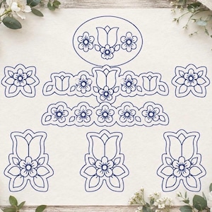 May include: A collection of dark blue line art floral motifs arranged on a light background. The set includes an oval frame, a horizontal border, two square floral accents, and three individual tulip-inspired flower designs with leaves.
