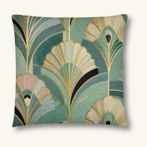 May include: A square throw pillow featuring a repeating fan-shaped pattern in shades of teal, sage green, and soft pink. The design is accented with thin, metallic gold lines that outline the fan motifs against a textured, fabric-like background.
