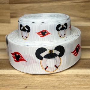 May include: Two stacked rolls of white grosgrain ribbon featuring a repeating pattern of black Mickey Mouse ears wearing a white captain's hat atop a white life preserver, interspersed with red and white wavy cruise ship funnel graphic icons.