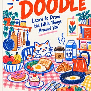 May include: A book cover titled Everyday Doodle Vol.02 Food & Kitchen, featuring a colorful crayon-style illustration of a cat at a table with breakfast items including a fried egg, toast, milk, a donut, a cupcake, and a red kettle.