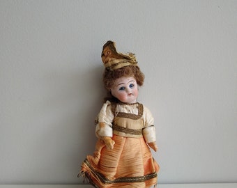 A Small Bisque Headed Doll, 5 ins