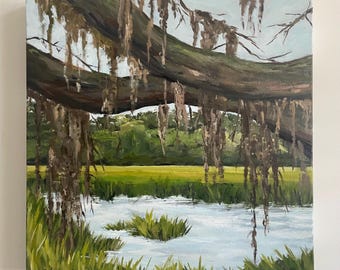 May include: An oil painting of a marsh scene. A large, brown tree branch with hanging moss dominates the top of the canvas. Below, a body of water reflects the sky, with green marsh grass in the foreground and background. The artist's signature is in the lower left corner.