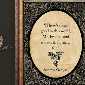 May include: Framed artwork featuring a quote from Samwise Gamgee: "There's some good in this world, Mr. Frodo... and it's worth fighting for." The quote is in an oval shape with a decorative border. The frame is brown and gold.