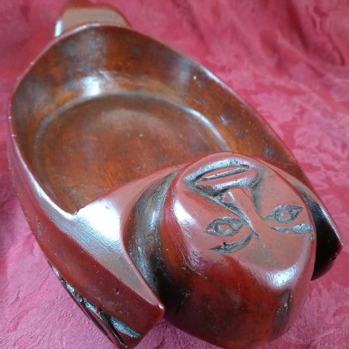Wood copy of Alaska bird and man shops vessel