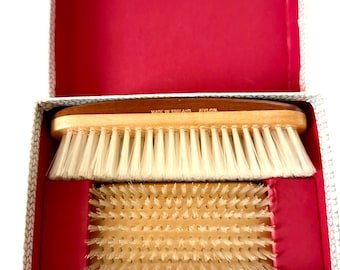 Pair of vintage wooden base clothing brushes in box