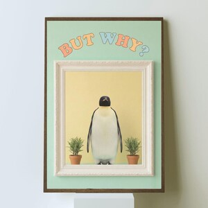 May include: Framed art print featuring a penguin standing between two potted plants. The artwork has a yellow background and a white frame. The words "BUT WHY?" are written above the frame in colorful letters. The frame is set against a light green background.