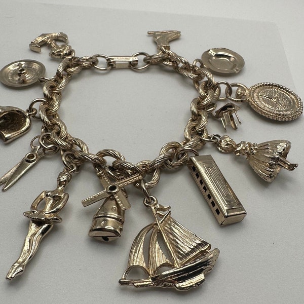 Vintage Gold Tone Charm Bracelet Loaded with 13 Charms/ Ice Skate, Pocket Watch,Roulette,Anchor,SouthernBelle,Harmonica,Ship, Windmill, more