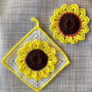 May include: Two crocheted sunflower dishcloths, one is a square with a white background and the other is a round shape with a yellow background.
