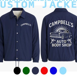 May include: Navy blue jacket with white text that reads "CAMPBELL'S" on the front and "CAMPBELL'S AUTO BODY SHOP" with a car graphic on the back. The jacket has a button-up front and a drawstring at the bottom.