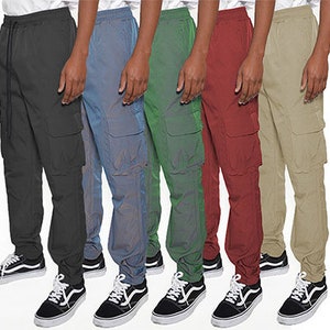 May include: Five pairs of cargo pants in different colors: black, blue, green, red, and beige. The pants have multiple pockets and a drawstring waistband.