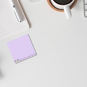 May include: A lavender sticky note with a cartoon dog peeking out from the bottom left corner and paw prints along the bottom edge.