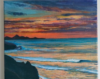 Peinture de plage au coucher du soleil avec chevalet