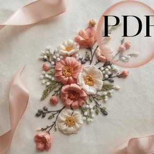 May include: A floral embroidery design with peach and cream flowers, yellow centres, green leaves, and white bead accents. A pink ribbon curves around the design. The word "PDF" is in a pink circle in the upper right corner.