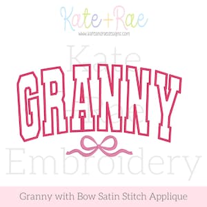 May include: A pink embroidered design with the word "GRANNY" in a bold, arched font. Below the word is a pink bow. The design is set against a white background, with the text "Kate + Rae" at the top.