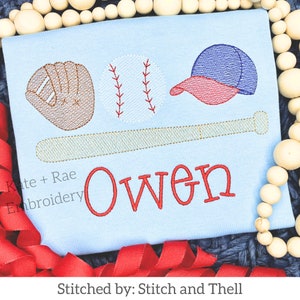 May include: A light blue baby onesie with embroidered baseball themed graphics, including a baseball, bat, glove, and cap. The name "Owen" is embroidered in red below the graphics.