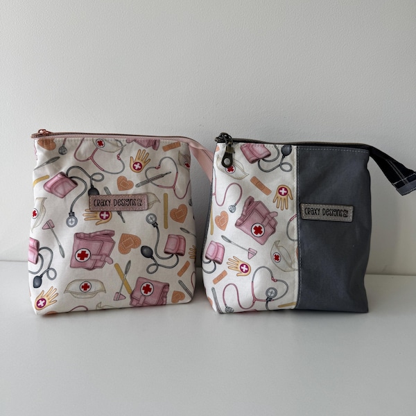 Handmade zip pouches and cosmetic bags by Craxy Designs — a navy, pink and rose gold floral pouch