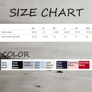 May include: Size chart for a t-shirt with measurements in inches for XS, S, M, L, XL, and 2XL. Color options include Solid White Blend, Solid Black Blend, Athletic Heather, Solid Baby Blue, Solid Natural Blend, Solid Navy Blend, Solid Pink Blend, and Solid Red Blend.
