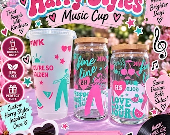 May include: Three cups featuring Harry Styles inspired graphics. One tall frosted plastic cup with a lid and two clear glass tumblers with bamboo lids. The designs include pink and teal text, hearts, cherries, and silhouettes of a person.