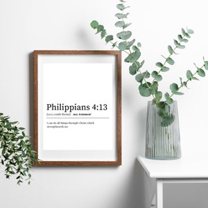 May include: A framed print with a white background and black text. The text reads "Philippians 4:13 [2023 youth theme] new testament I can do all things through Christ which strengtheneth me".