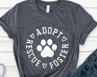 May include: A heather grey t-shirt with a white paw print and the text "Rescue Adopt Foster" in a circle around the paw print.