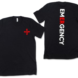 May include: Black t-shirt with a red medical cross on the front and the word "EMERGENCY" in white letters down the back.