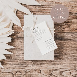 May include: A set of 5 gift tags with a rustic wood background. The tags are white with black text and include the text "Family and Friends" and "Weekend Events". The tags are 2 x 3.5 inches and 3 x 6 inches.