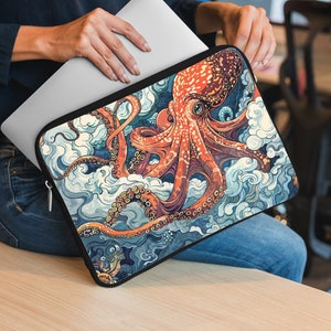 May include: A laptop sleeve featuring a colourful illustration of an octopus with swirling blue and white clouds. The octopus is orange and red with detailed tentacles.