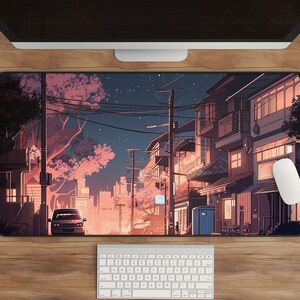 May include: A digital illustration of a city street at night with pink cherry blossoms, a car, and buildings with lights on. The illustration is in a cartoon style and has a soft, dreamy aesthetic.