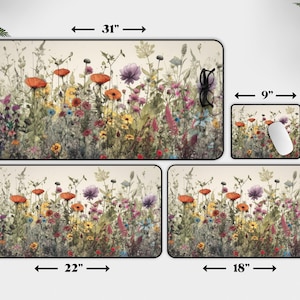 May include: A set of four mousepads featuring a watercolor-style illustration of a field of wildflowers in shades of pink, purple, yellow, and orange. The mousepads are available in three sizes: 9x7 inches, 18x12 inches, and 22x12 inches. The largest mousepad is 31x15.5 inches.