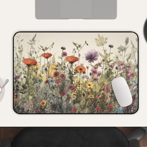 May include: A colorful floral design mousepad with a variety of flowers in shades of red, orange, yellow, pink, and purple. The flowers are arranged in a row across the bottom of the mousepad, with a light brown background.