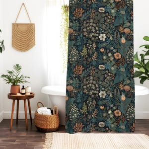 May include: A dark blue shower curtain with a floral pattern featuring various shades of green, orange, and white flowers. The pattern is a repeating design of flowers and leaves.