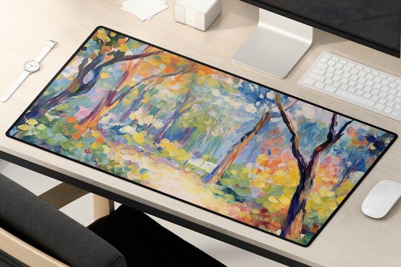 May include: A colorful abstract painting of a forest scene with trees and foliage in shades of blue, green, yellow, and pink. The painting is on a black background and is framed with a black border.