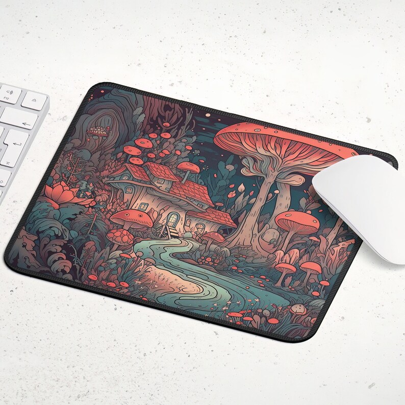 May include: A whimsical mousepad featuring a colorful illustration of a mushroom forest with a small house, a winding path, and a variety of mushrooms in shades of red, orange, and pink.
