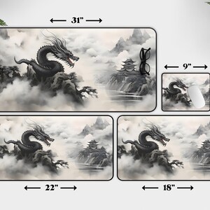 May include: A set of four mouse pads featuring a black dragon in a misty mountain landscape. The largest pad is 31 inches by 15.5 inches, the next largest is 22 inches by 12 inches, the third is 18 inches by 12 inches, and the smallest is 9 inches by 7 inches.