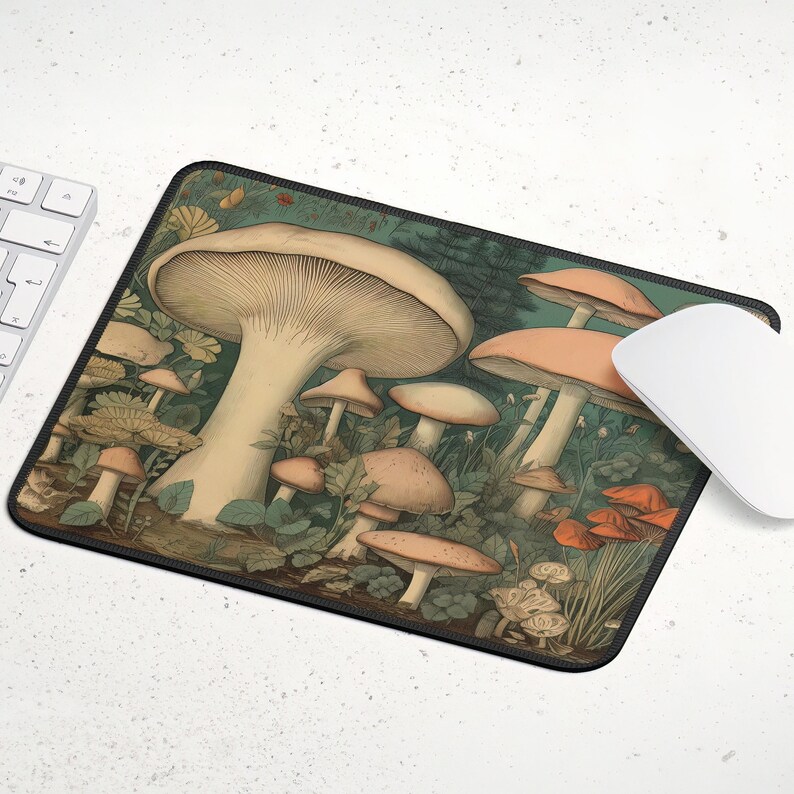May include: A mouse mat featuring a vintage illustration of mushrooms in various sizes and colours against a green background.