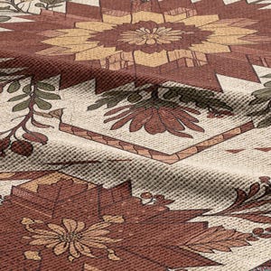Puede incluir: Primer plano de un textil estampado con un dise&ntilde;o floral en tonos marr&oacute;n, beige y verde. La tela tiene un aspecto texturizado con un patr&oacute;n geom&eacute;trico y bot&aacute;nico repetitivo. El dise&ntilde;o incluye flores y hojas estilizadas.