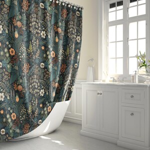 May include: A teal shower curtain with a floral pattern featuring various shades of green, brown, and orange. The curtain is hung in a bathroom with a white bathtub and white cabinets.