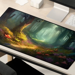 May include: A black and green mousepad with a fantasy forest scene. The scene features a path leading into a forest with tall trees and a misty atmosphere. The path is lined with colorful flowers and mushrooms.