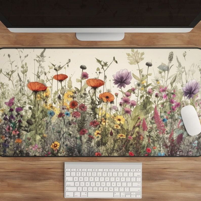 May include: A watercolor-style illustration of a field of wildflowers in shades of red, orange, yellow, purple, and blue. The flowers are arranged in a dense, layered pattern, creating a sense of depth and movement. The background is a soft, cream color.