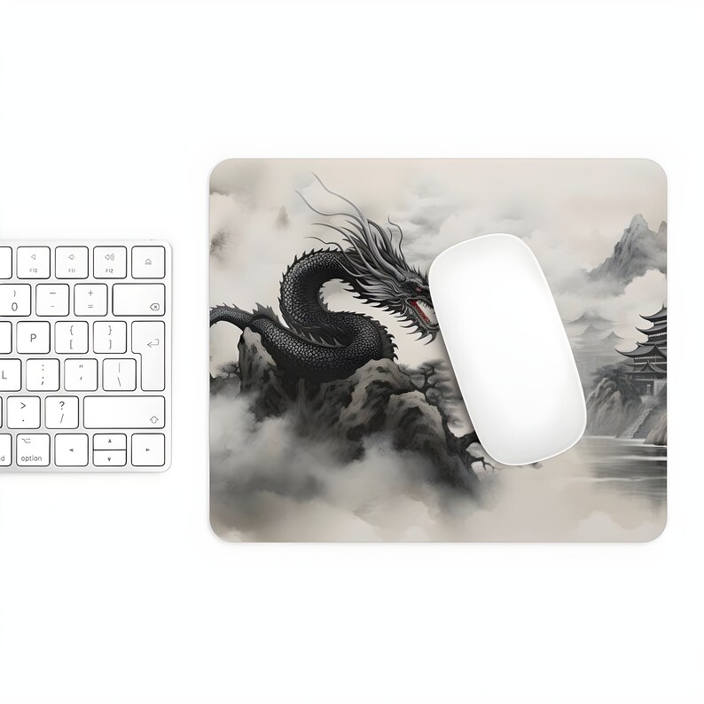 May include: A black dragon with red eyes is depicted in a traditional Japanese style, flying over a mountain range with a pagoda in the background. The design is on a light gray mouse pad.