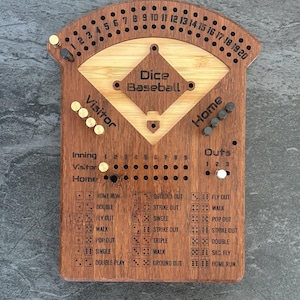 May include: Wooden Dice Baseball game with a baseball field design. The game board features the text "Dice Baseball", along with spaces for innings, outs, and dice roll results. Includes pegs and a curved top with numbers.