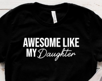 May include: Black t-shirt with white text that reads "Awesome Like My Daughter".