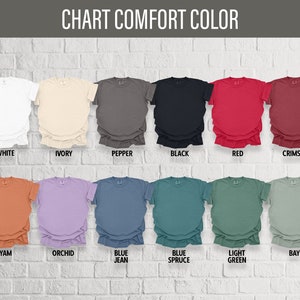 May include: Chart of t-shirt colors with names for each color: White, Ivory, Pepper, Black, Red, Crimson, Yam, Orchid, Blue Jean, Blue Spruce, Light Green, Bay.