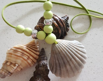 A natural handmade necklace with light green beads