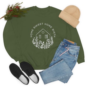 May include: A green sweatshirt with a white graphic of a house with flowers and the text "Home Sweet Home Birth".