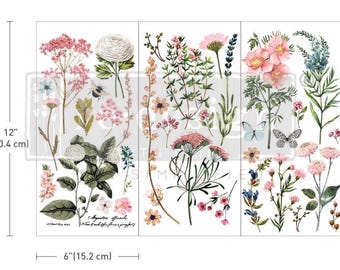 May include: A floral transfer sheet, 30.4 cm tall and 15.2 cm wide, with botanical illustrations. The design includes various flowers, leaves, butterflies, and a bee in shades of pink, white, and green.