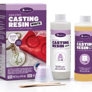 May include: A kit for casting resin, including two bottles of resin, mixing sticks, and measuring cups. The box and bottles are labeled "Amazing Casting Resin White." The kit includes 16 oz (473 ml) total.