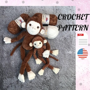 May include: Crochet pattern for two brown plush monkey toys with white accents. The pattern is available as a PDF download. The image also shows two balls of brown yarn and one ball of white yarn.