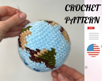 May include: A crochet pattern for a globe-shaped amigurumi toy. The globe is blue with brown, green, and beige continents. The pattern is available as a PDF download.
